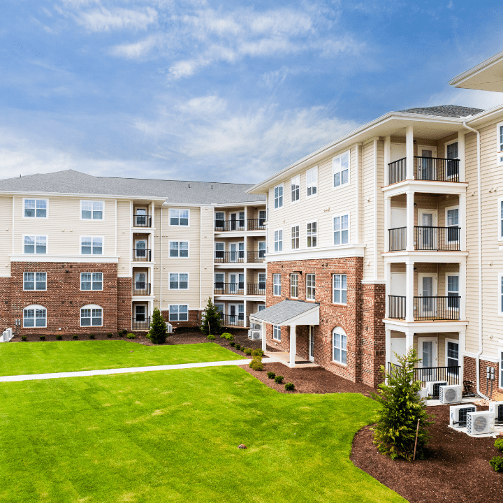 Outside VIew of Building With LIght Grass